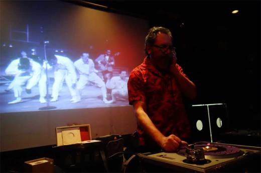 Mr. Fine Wine cues a record as Smokey Robinson and the MIracles do "Mickey's Monkey" behind him!