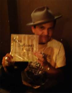 Tony Salvaje shows off one of the fine records he played at WHAM-O WATUSI!
