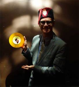 Phast Phreddie the Boogaloo Omnibus displays his yellow Bobby Darin record at WHAM-O WATUSI!