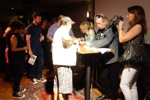 Gillian McCain and Legs McNeil sign autographs at the Please Kill Me - 20th Anniversary Tour event.